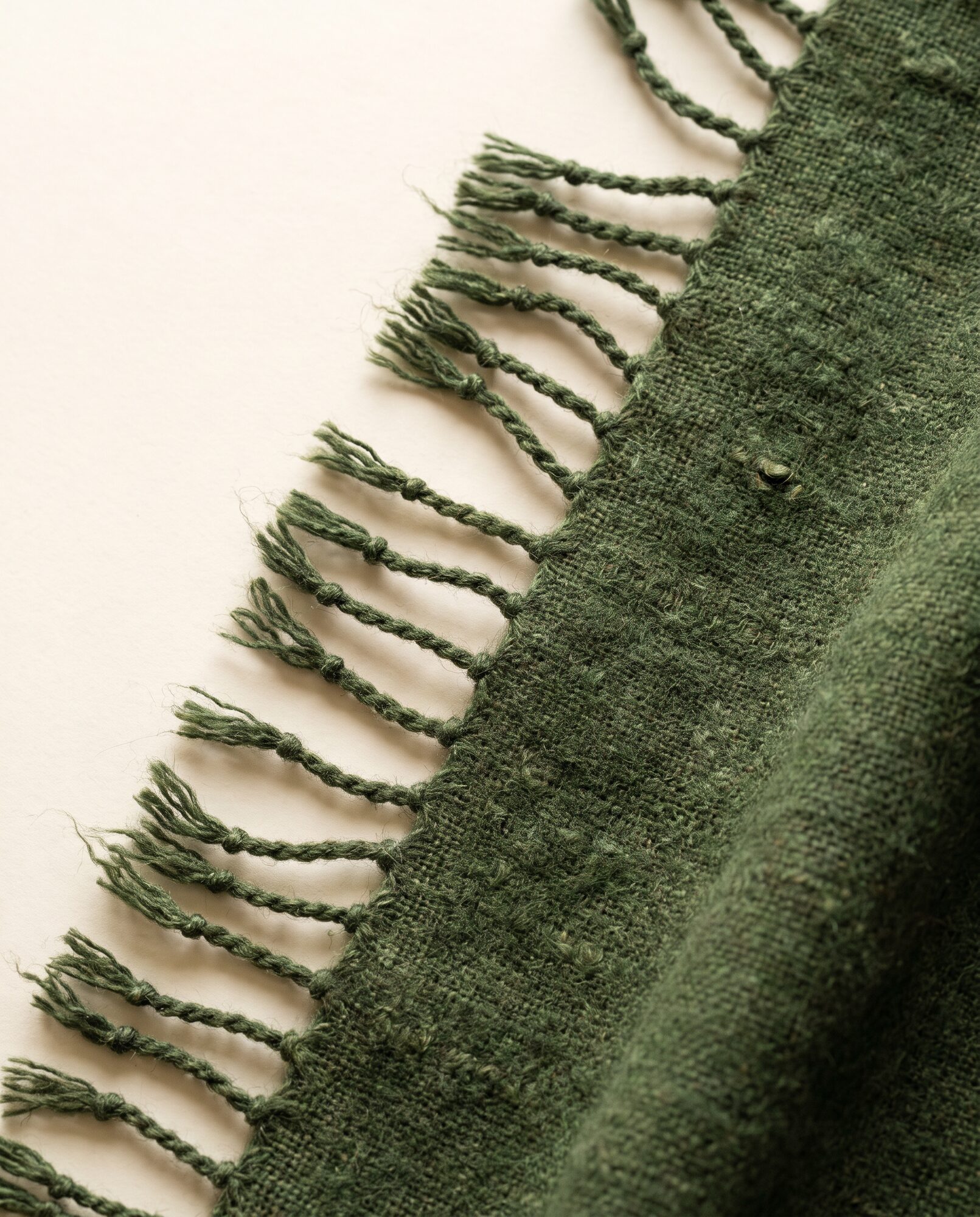 Handloom khaddar Close-up of moss khaddar showing the handloom slub and weave texture