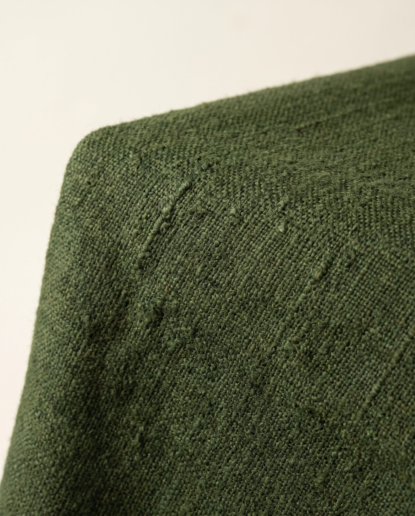 Moss khaddar in close-up, showing the uneven handloom slub in the yarn
